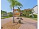 Beautiful home featuring lush landscaping, red brick driveway, and a 2-car garage at 1011 Sonata Ln, Apollo Beach, FL 33572