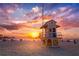 Lifeguard tower on a sandy beach, with colorful sunset skies as the backdrop at 12361 114Th St, Largo, FL 33778