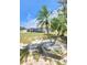 Charming home with tropical landscaping including palm trees in the front yard at 12361 114Th St, Largo, FL 33778
