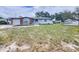 Well-maintained home with brick accents, a one-car garage, and a spacious front lawn at 12361 114Th St, Largo, FL 33778