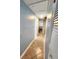 Bright hallway with tile flooring leading to bedrooms, offering a glimpse of a room with natural light at 12361 114Th St, Largo, FL 33778