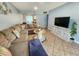 Relaxing living room with tile floors, large sectional sofa, and modern accents at 12361 114Th St, Largo, FL 33778