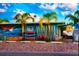A commercial building featuring surfboards, kayaks and surf themed mural in vibrant colors at 12361 114Th St, Largo, FL 33778