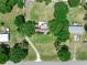 An aerial view of a home with a large yard and a long driveway at 12526 Spottswood Dr, Riverview, FL 33579