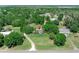 Spacious property with lush landscaping featuring a manufactured home, mature trees, and a long private driveway at 12526 Spottswood Dr, Riverview, FL 33579