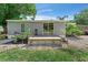 Backyard deck area with sliding glass door and gravel landscape at 12526 Spottswood Dr, Riverview, FL 33579