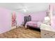 Bedroom featuring wood floors, a ceiling fan and storage in closet at 12526 Spottswood Dr, Riverview, FL 33579