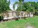 Well-kept single-Gathering home with tidy landscaping and a cozy front porch entrance at 12526 Spottswood Dr, Riverview, FL 33579