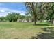 Inviting exterior elevation of a manufactured home on a spacious lot with beautiful mature trees at 12526 Spottswood Dr, Riverview, FL 33579