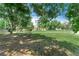 Charming manufactured home with a spacious lawn and mature trees enhancing its curb appeal at 12526 Spottswood Dr, Riverview, FL 33579