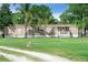Charming single-story home with a welcoming front porch and a well-maintained lawn at 12526 Spottswood Dr, Riverview, FL 33579