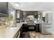 Bright kitchen with stainless steel appliances, and a view of the window over the sink at 12526 Spottswood Dr, Riverview, FL 33579