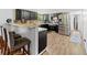 Modern kitchen features stainless steel appliances and a breakfast bar at 12526 Spottswood Dr, Riverview, FL 33579