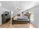 Main bedroom featuring wood floors, a ceiling fan and natural light at 12526 Spottswood Dr, Riverview, FL 33579