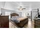 Spacious main bedroom with a ceiling fan and an ensuite bathroom featuring a double vanity at 12526 Spottswood Dr, Riverview, FL 33579