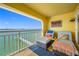 Relaxing balcony with lounge chairs offering scenic waterfront views at 370 8Th N Ave # 7, Tierra Verde, FL 33715