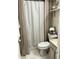 This bathroom showcases a shower with neutral accents and a convenient shelf for storage at 4300 58Th N St # 1909, Kenneth City, FL 33709