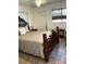 This bedroom includes an ornate bedframe, a sitting area and natural lighting at 4300 58Th N St # 1909, Kenneth City, FL 33709