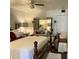 A bedroom with a ceiling fan, full-size bed, side tables, and a mirrored vanity table at 4300 58Th N St # 1909, Kenneth City, FL 33709