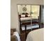 A bedroom is reflected in a mirrored sliding closet door featuring a full-size bed at 4300 58Th N St # 1909, Kenneth City, FL 33709