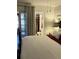 A bright and airy bedroom with an ensuite bathroom and a door to the outside at 4300 58Th N St # 1909, Kenneth City, FL 33709