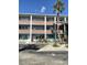 The condominium building has multiple stories with brick accents, offering covered parking at 4300 58Th N St # 1909, Kenneth City, FL 33709