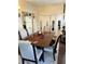Dining area featuring a spacious dining table with six chairs and a view into the kitchen at 4300 58Th N St # 1909, Kenneth City, FL 33709