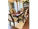 Formal dining room features hardwood floors, an area rug, and an antique cabinet at 4300 58Th N St # 1909, Kenneth City, FL 33709