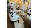 A bright living room showcasing stylish, ornate furniture, area rug, and wood flooring at 4300 58Th N St # 1909, Kenneth City, FL 33709