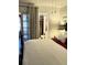 Inviting main bedroom features an ensuite bathroom and sliding door access to an outdoor space at 4300 58Th N St # 1909, Kenneth City, FL 33709