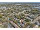 Drone shot of the house showing the location, mature trees, detached garage, and neighborhood at 8203 Interbay Blvd, Tampa, FL 33616