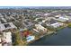 Breathtaking aerial view of the community, showcasing lush landscaping, a pool, and a serene lake at 11485 Oakhurst Rd # A301, Largo, FL 33774