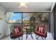 Relax on your balcony with two chairs and table to enjoy overlooking lush trees and gardens at 11485 Oakhurst Rd # A301, Largo, FL 33774