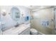Modern bathroom showcasing a glass-enclosed shower, granite counters, and custom vanity with decorative lighting at 11485 Oakhurst Rd # A301, Largo, FL 33774