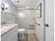 Elegant bathroom featuring a glass-enclosed shower, updated fixtures, and easy-to-clean tiled surfaces at 11485 Oakhurst Rd # A301, Largo, FL 33774