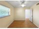 Inviting bedroom with a ceiling fan, window for natural light, and a closet, creating a cozy retreat at 11485 Oakhurst Rd # A301, Largo, FL 33774