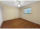 Well-lit bedroom featuring a ceiling fan, window for natural light, and a spacious closet for storage at 11485 Oakhurst Rd # A301, Largo, FL 33774
