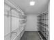 Organized walk-in closet featuring wire shelving, a closet rod, and cube storage system at 11485 Oakhurst Rd # A301, Largo, FL 33774