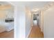 Hallway showing wood flooring and access to the kitchen and other rooms at 11485 Oakhurst Rd # A301, Largo, FL 33774