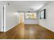 Bright living room boasts wood floors and a view into the kitchen at 11485 Oakhurst Rd # A301, Largo, FL 33774