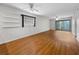 Bright living room with ceiling fan, wood floors and sliding glass doors to let in lots of natural light at 11485 Oakhurst Rd # A301, Largo, FL 33774