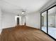 Spacious open-plan living room with wood floors and natural light, perfect for modern living at 11485 Oakhurst Rd # A301, Largo, FL 33774