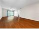 Spacious living area with ceiling fan and sliding glass doors at 11485 Oakhurst Rd # A301, Largo, FL 33774