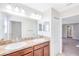 Bright bathroom featuring a double sink vanity with modern fixtures and ample counter space at 20209 Merry Oak Ave, Tampa, FL 33647