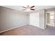 Neutral bedroom featuring ceiling fan, carpeted floor, and closet for a serene and functional space at 20209 Merry Oak Ave, Tampa, FL 33647