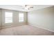 Cozy bedroom with natural light, carpet floors, and neutral paint at 20209 Merry Oak Ave, Tampa, FL 33647
