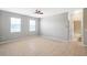 Light-filled bedroom with neutral walls, tile floors, and bright windows at 20209 Merry Oak Ave, Tampa, FL 33647