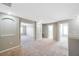 Open hallway with arched entryways and carpeted floors, providing seamless transitions between rooms at 20209 Merry Oak Ave, Tampa, FL 33647