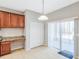 Bright kitchen with granite counters, breakfast bar, built-in desk and sliding door access at 20209 Merry Oak Ave, Tampa, FL 33647