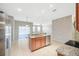 Large open kitchen with a kitchen island and tile flooring at 20209 Merry Oak Ave, Tampa, FL 33647